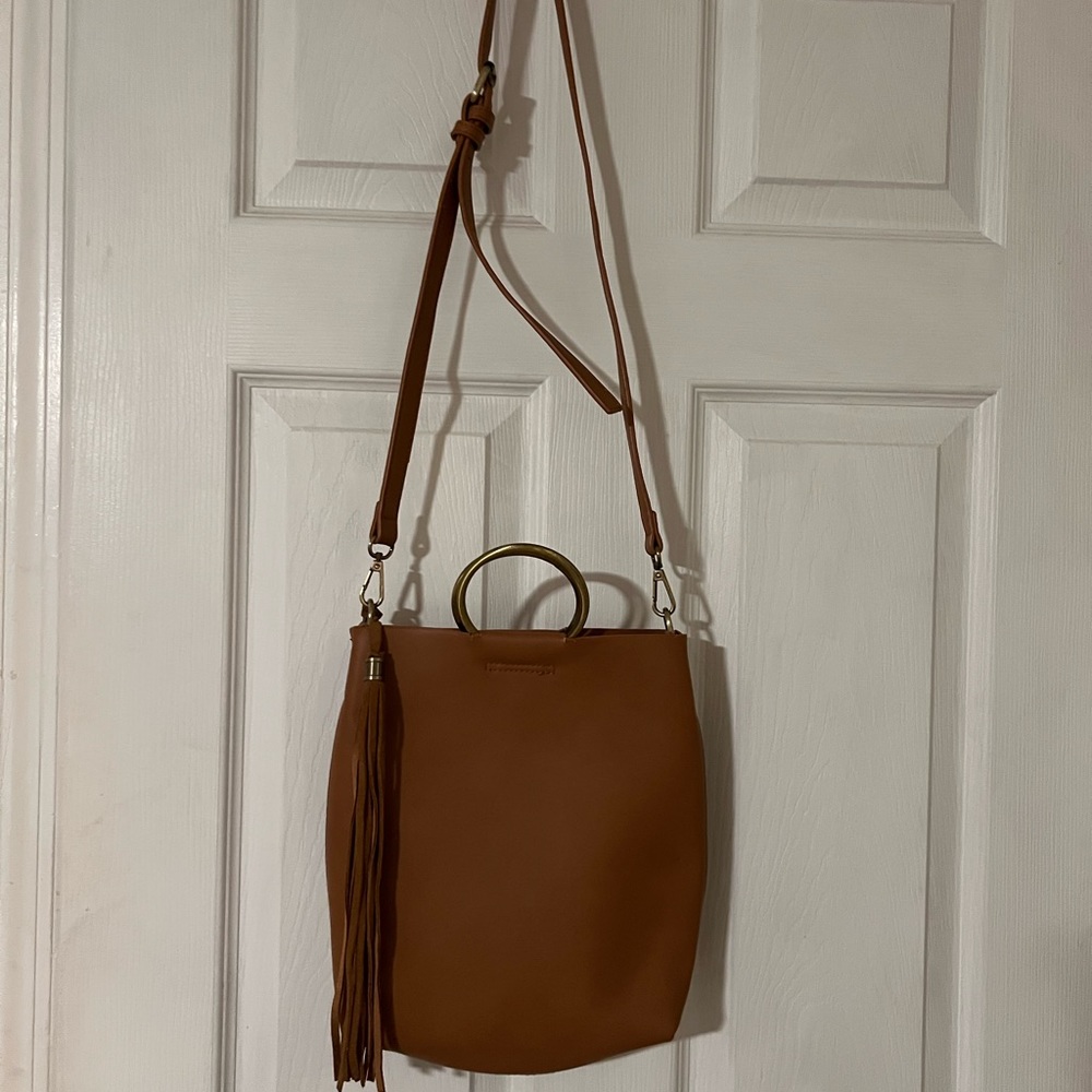 Camel colored cross body bucket style bag